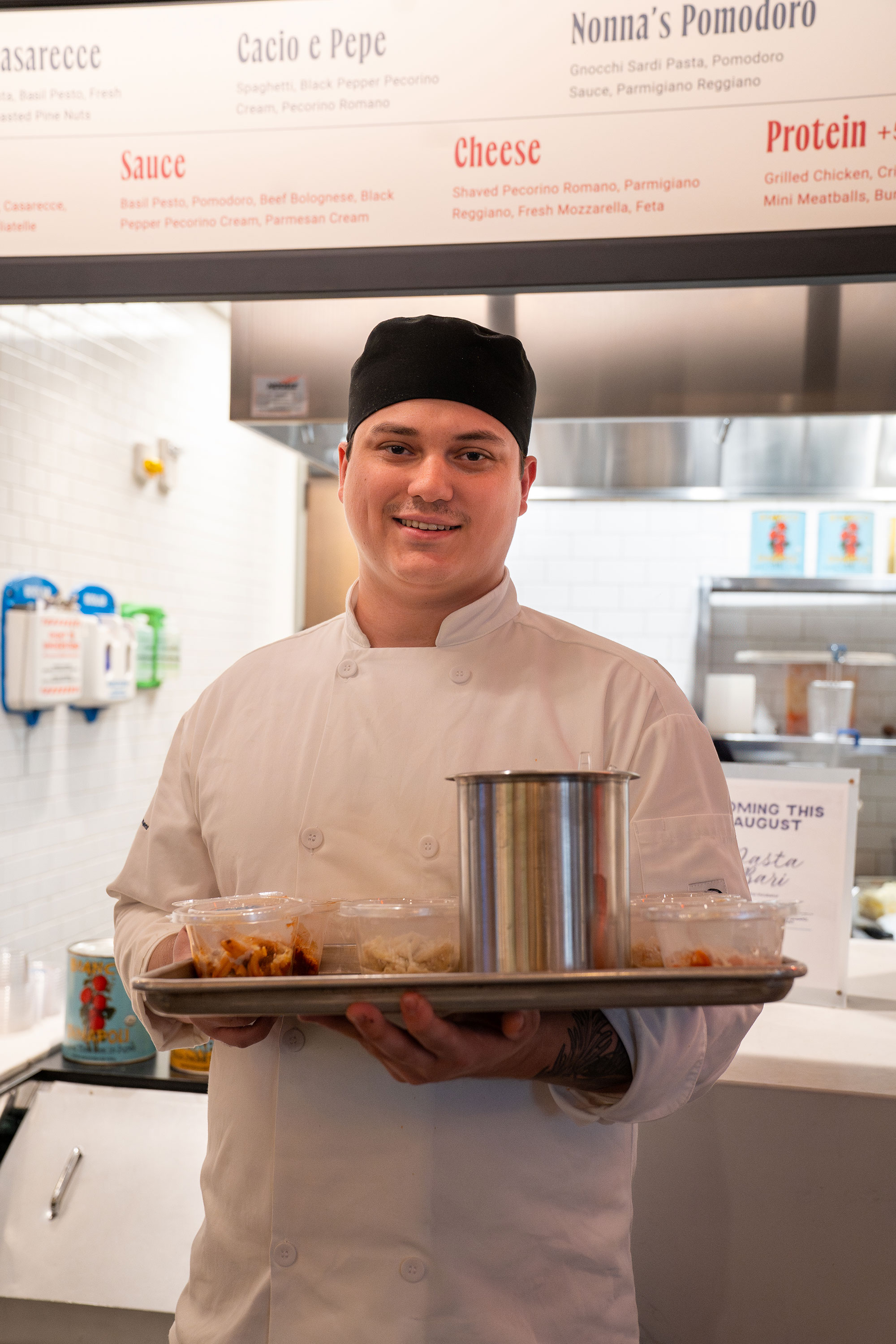Intern in front of pasta bari