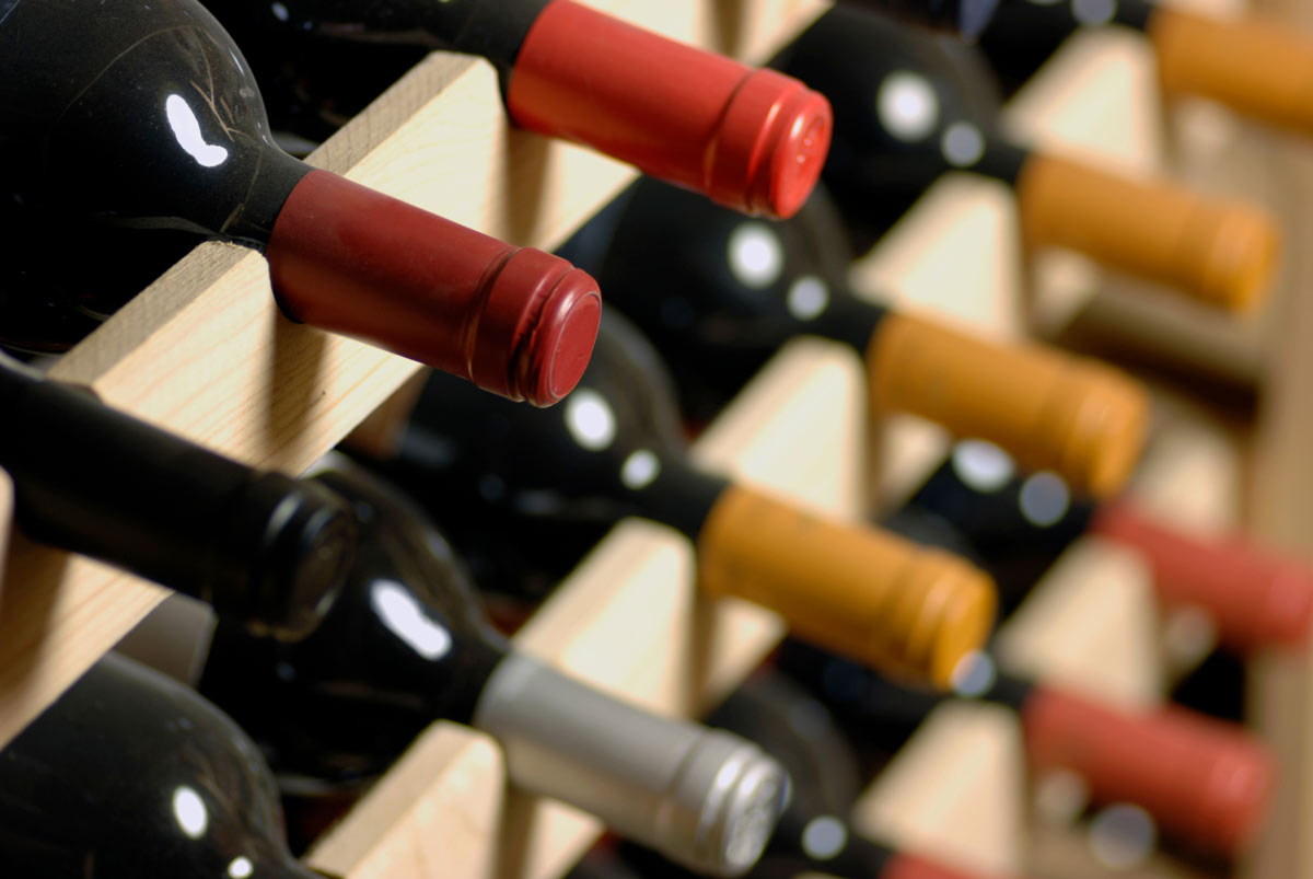 image of wines ina wooden wine rack.